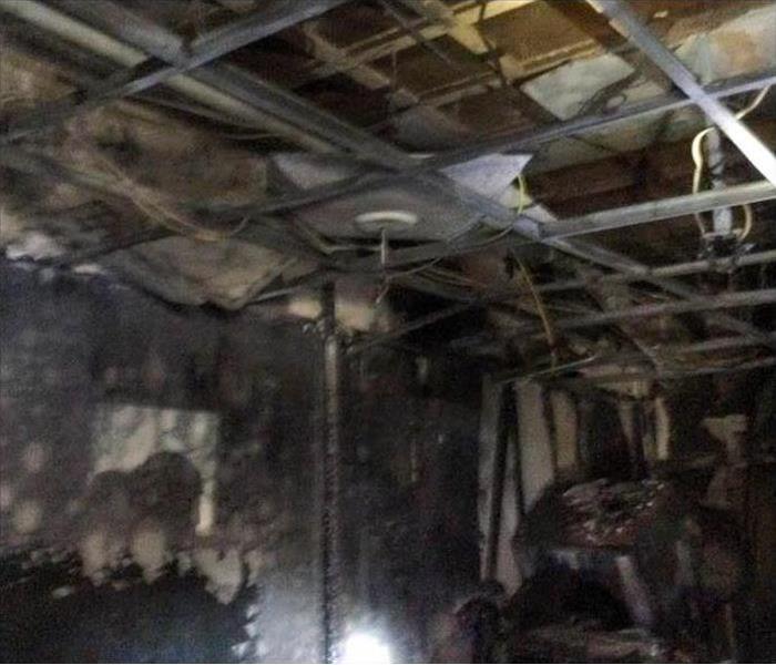 Ceiling, walls and structure damaged by fire